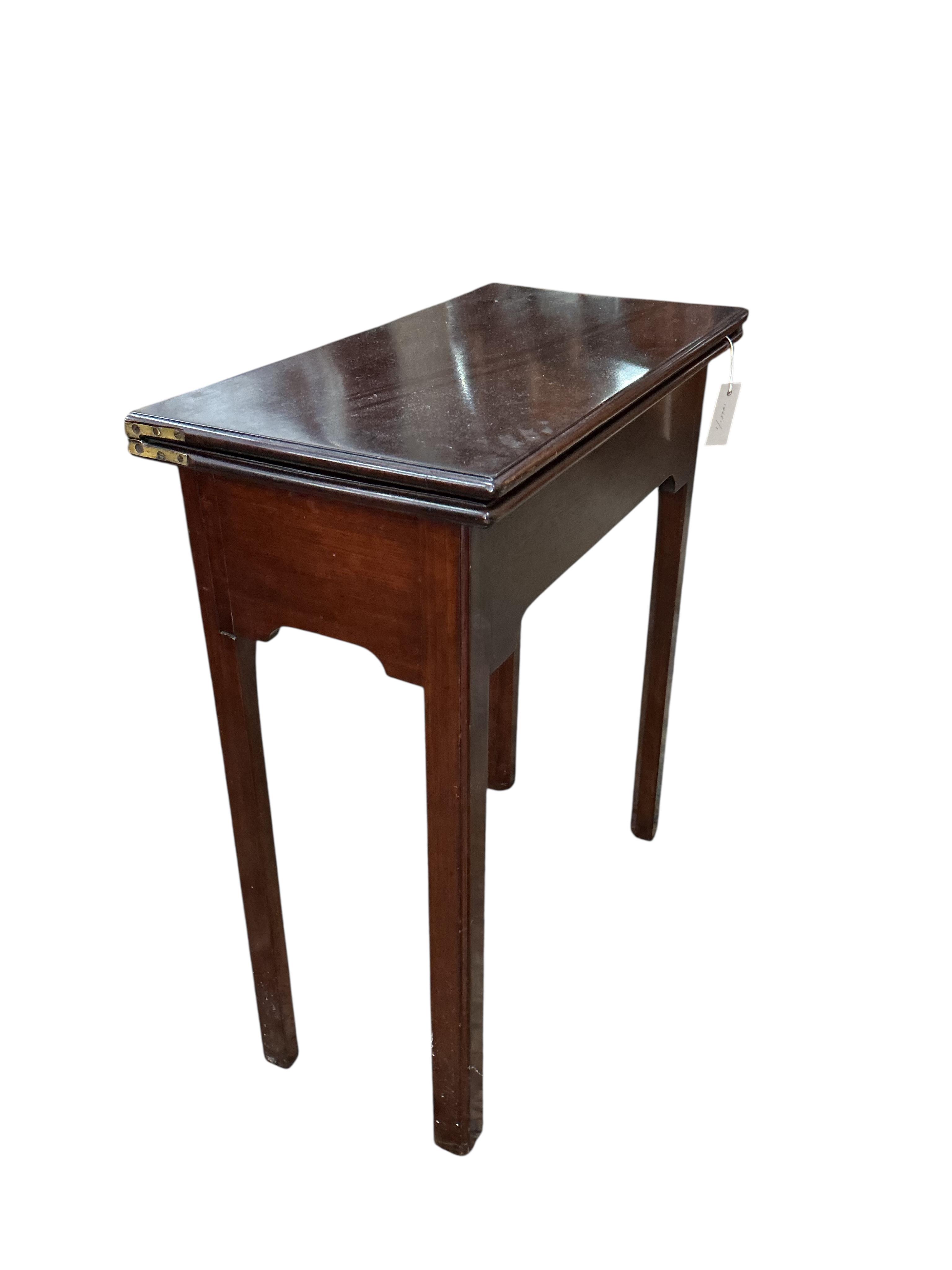 A George II rectangular mahogany folding tea table, width 63cm, depth 32cm, height 72cm